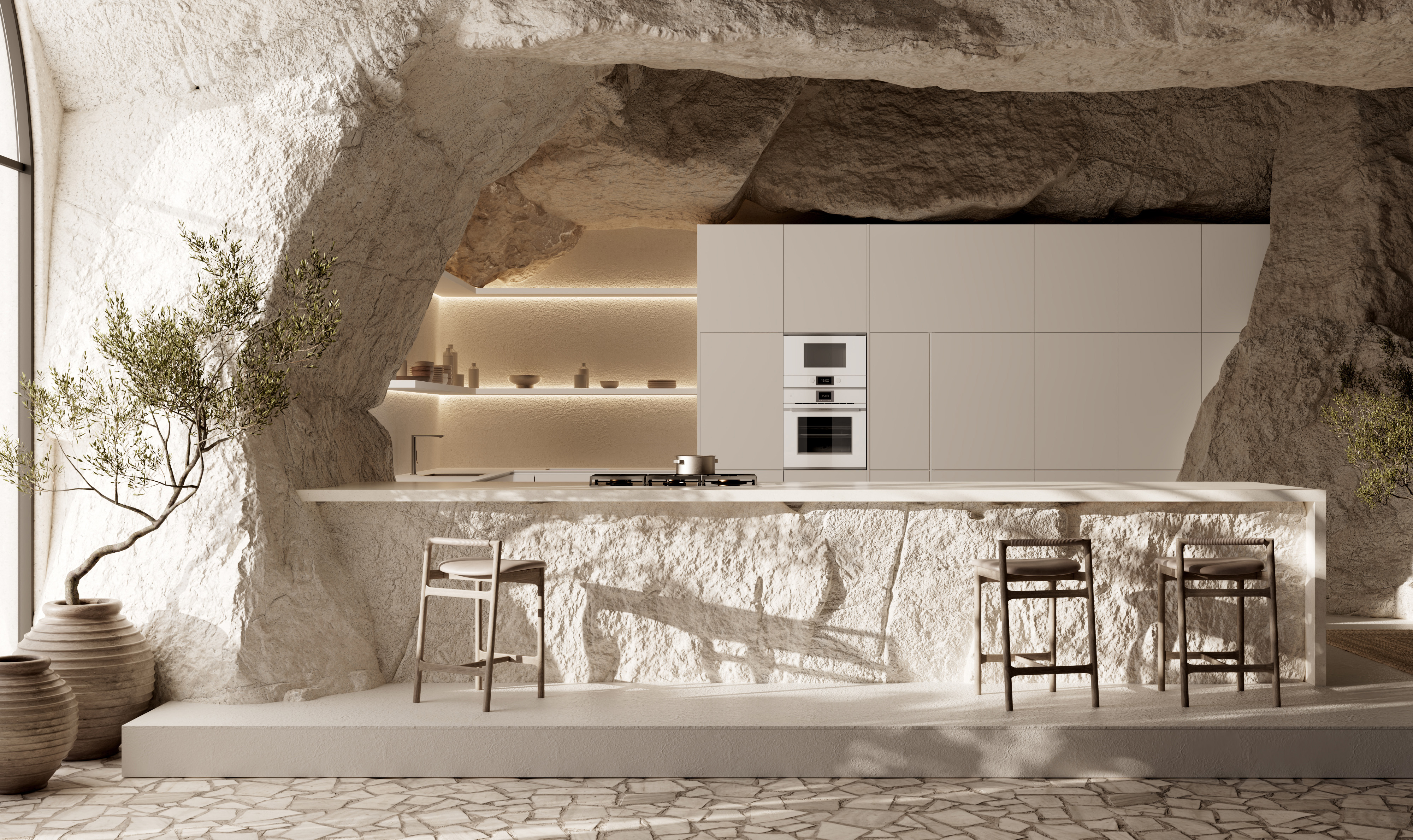 Küppersbusch weiße Einbaugeräte in mattweißer griffloser Küche in Felsnische mit Fels-Küchentheke